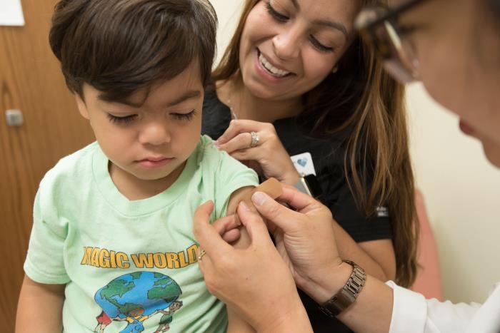 vaccine-influenza-cdc-r-denty Young child just received a seasonal influenza vaccine