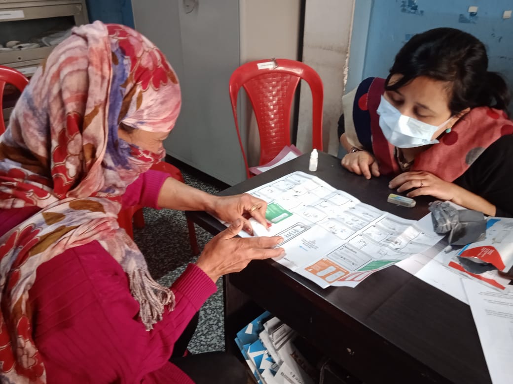 hiv-self-testing-india-path Client taking a HIV self-test
