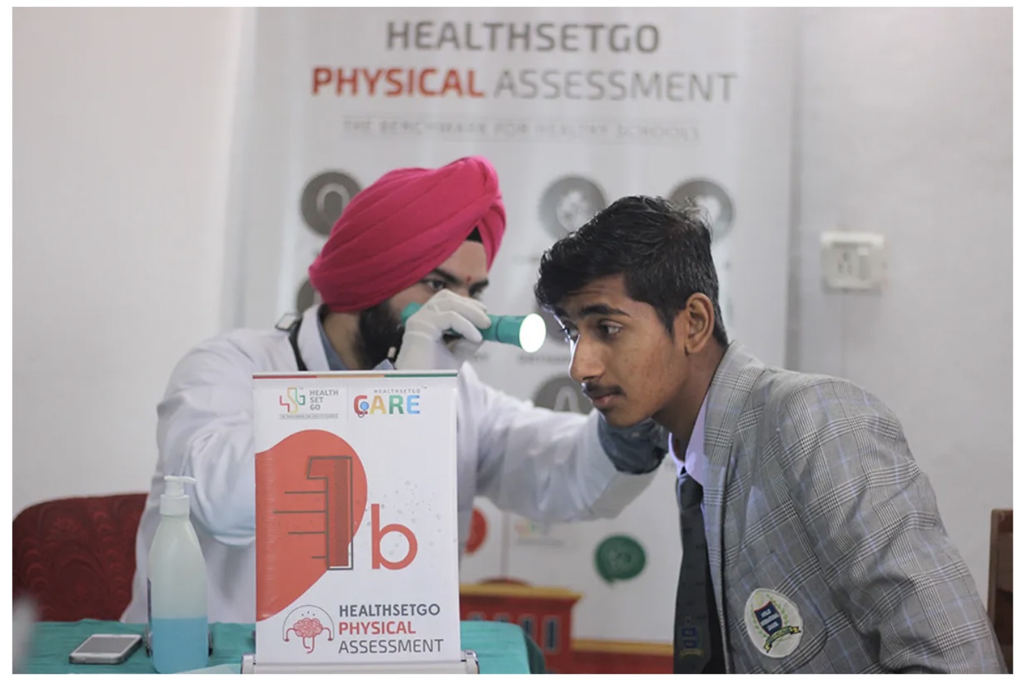 A doctor carrying out an assessment on his patient