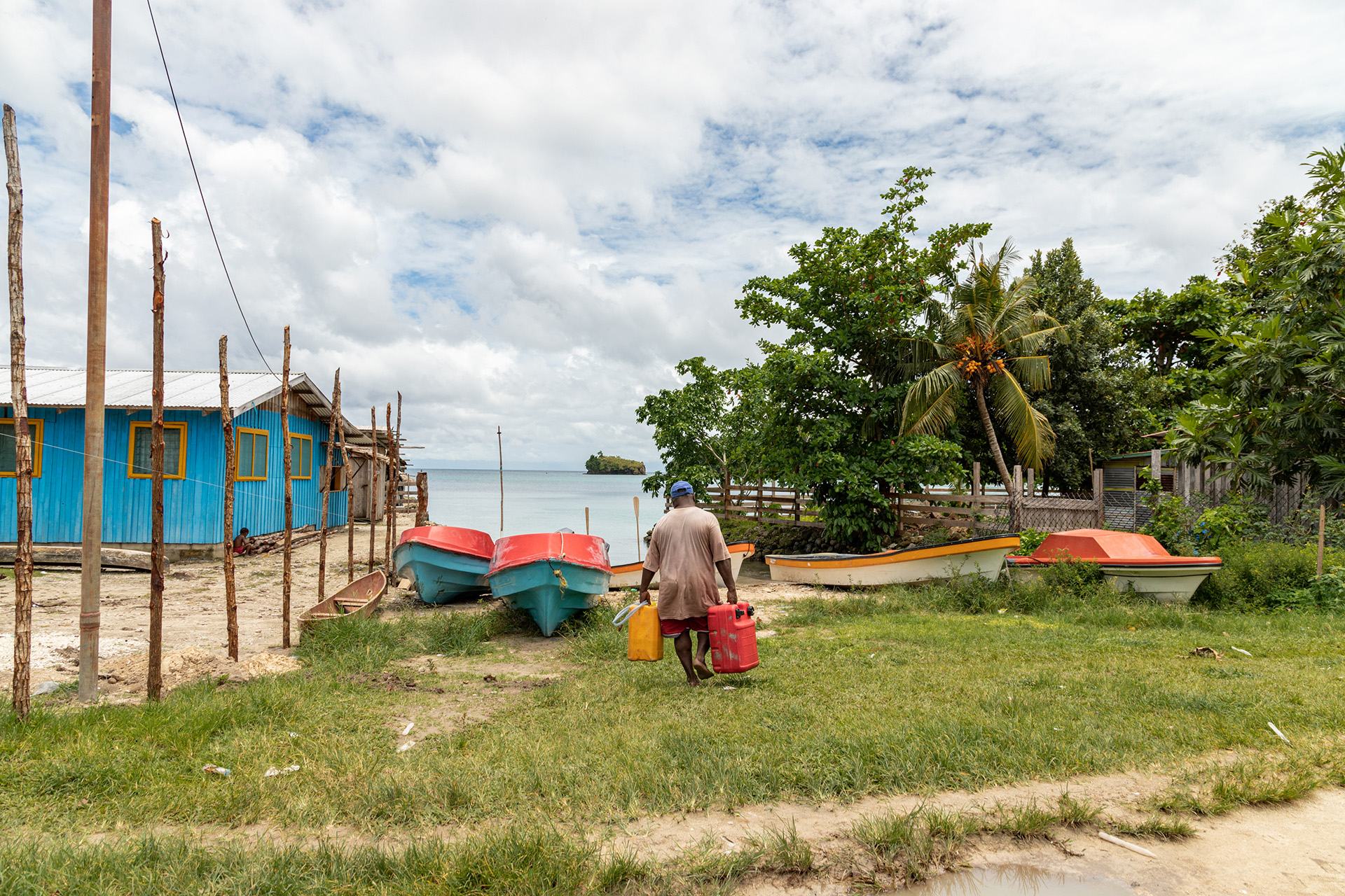 sids-action-on-ncds-hero a peron carrying petrol to their boat