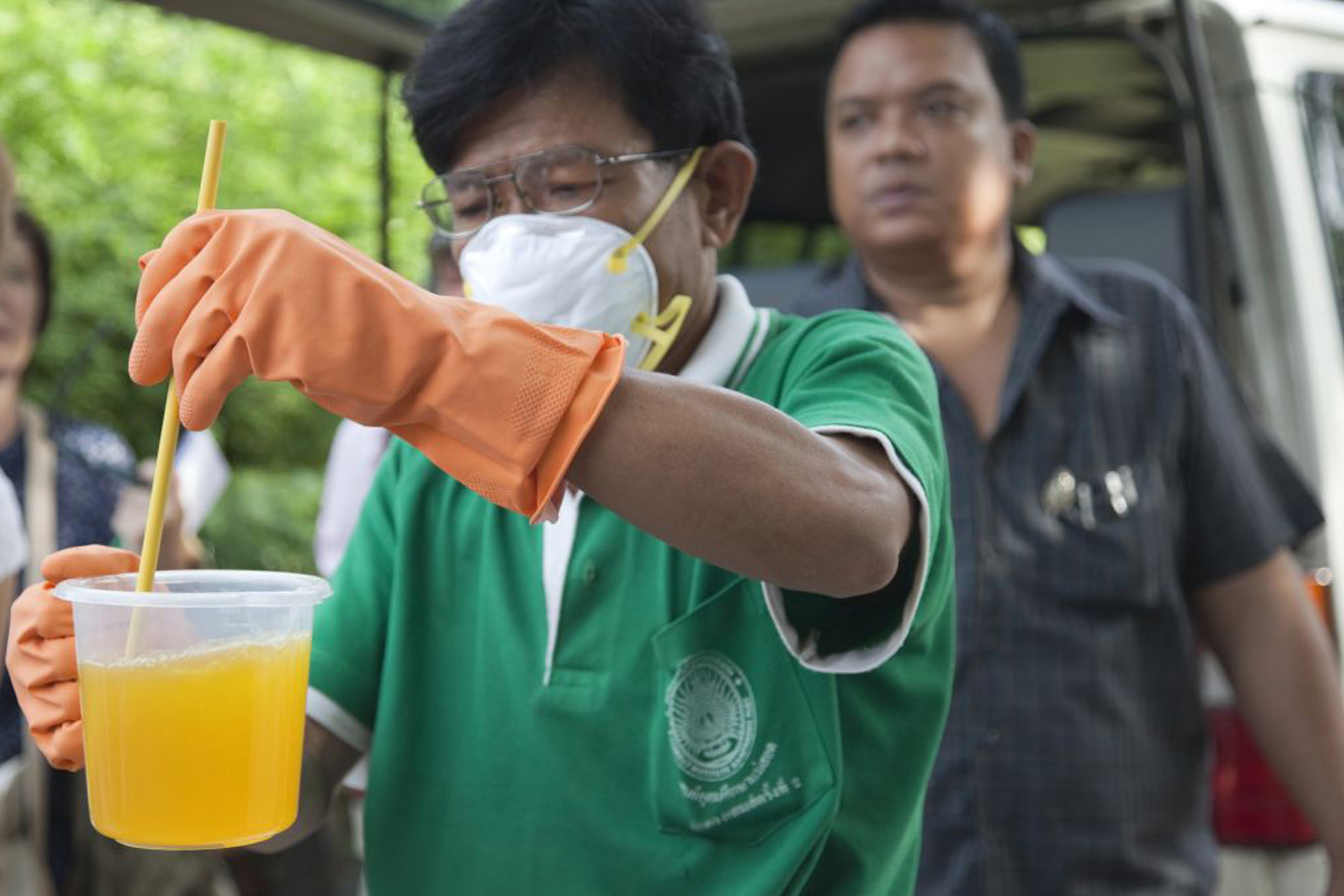 Dengue mosquito control in Bangkok Public Health dengue prevention staff prepare mosquito repellant for a fogging operation outside Bangkok.