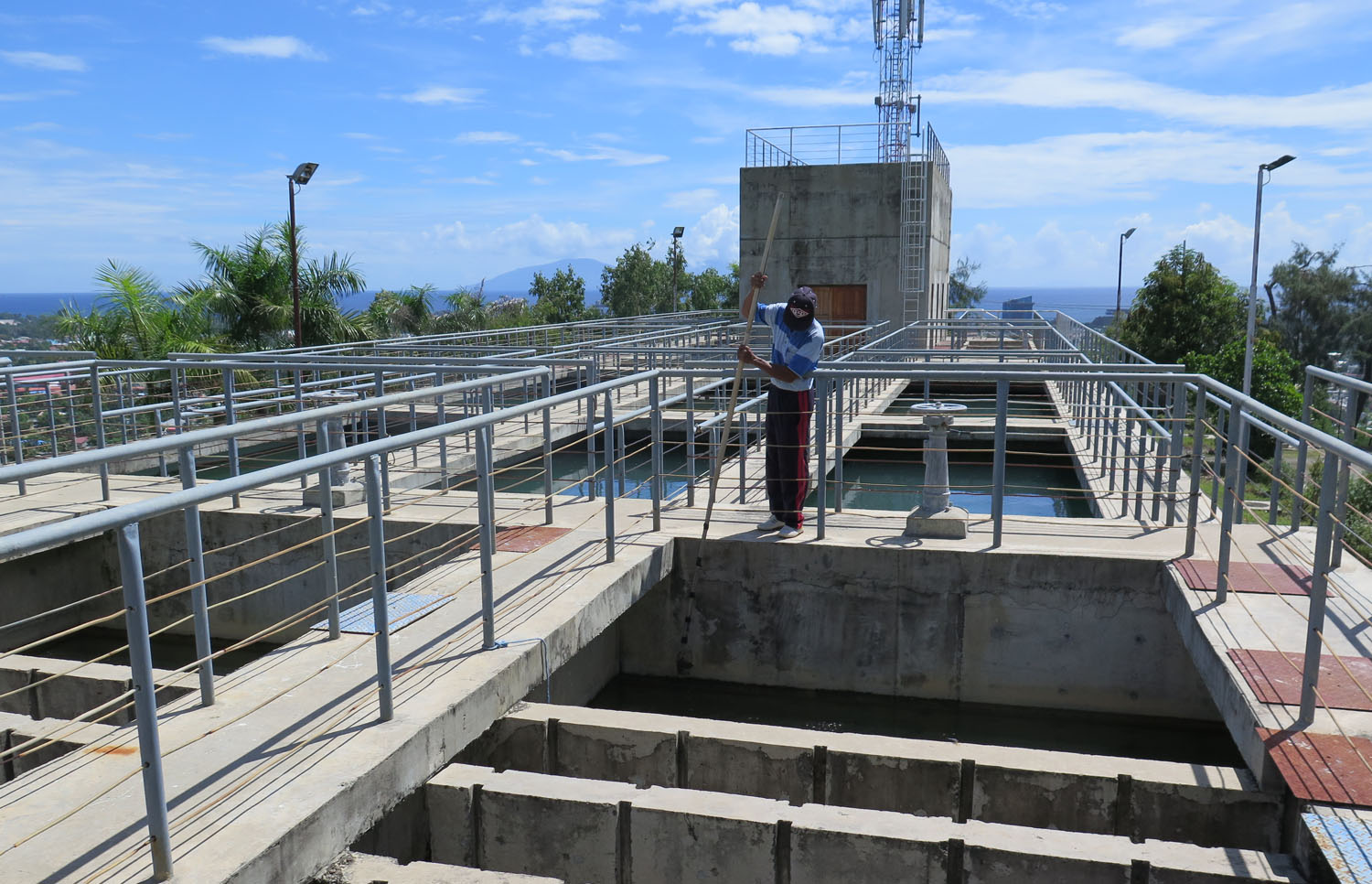 state-of-world-water-2022 Water purification plant in Timor-Leste with worker in the foreground