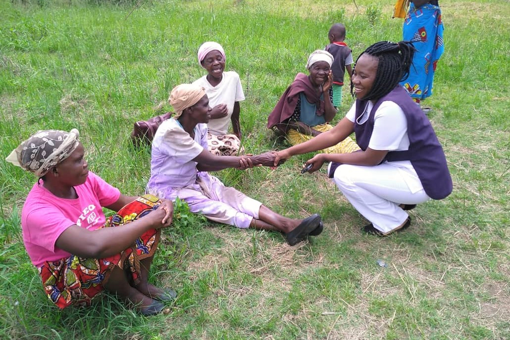 Nurse Carol during a community outreach Nurse Carole saluting women during a community outreach, Zambia
