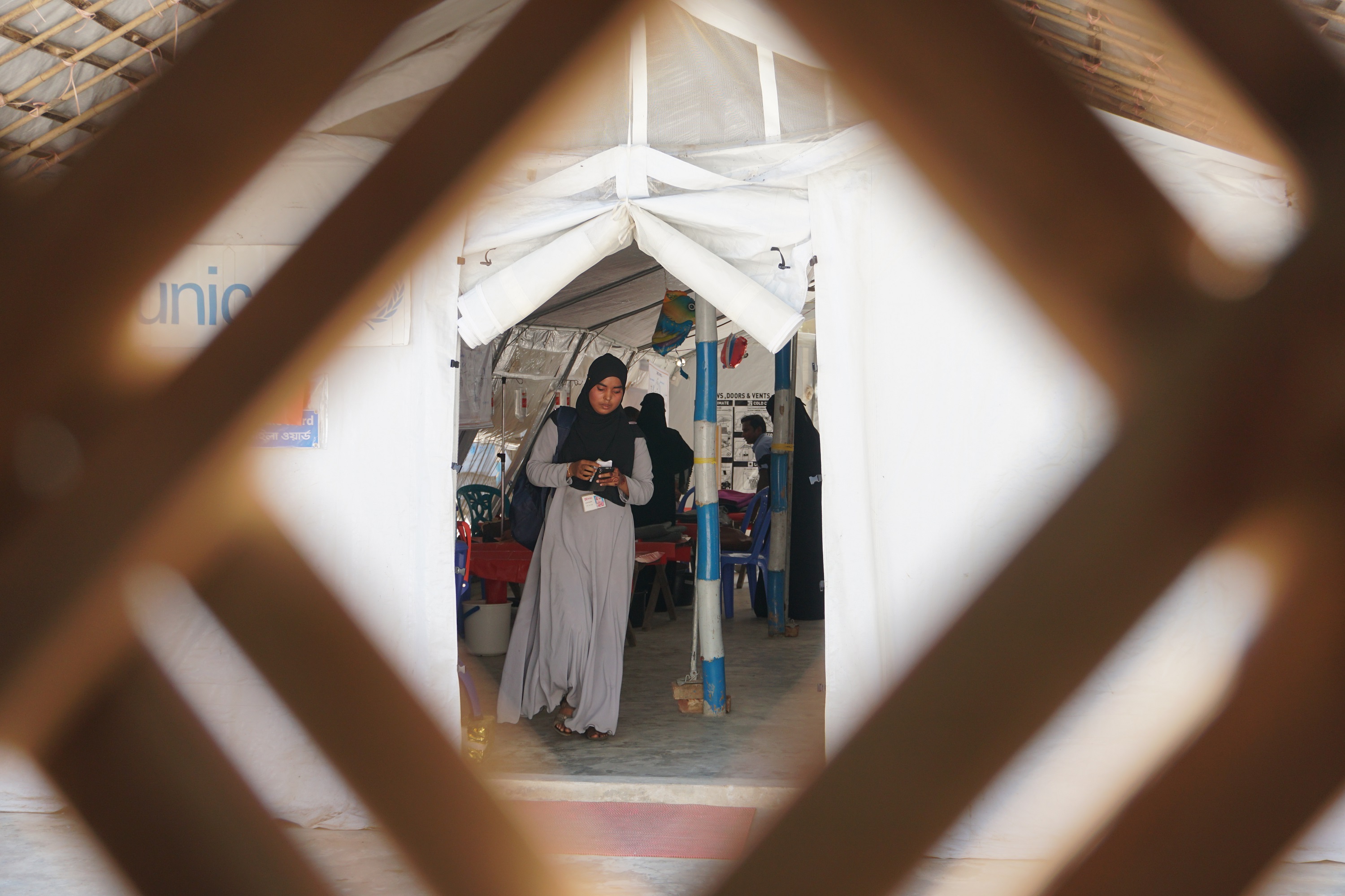 Woman walking out of a health facility - Tatiana Almeida Woman walking out of a health facility - Tatiana Almeida