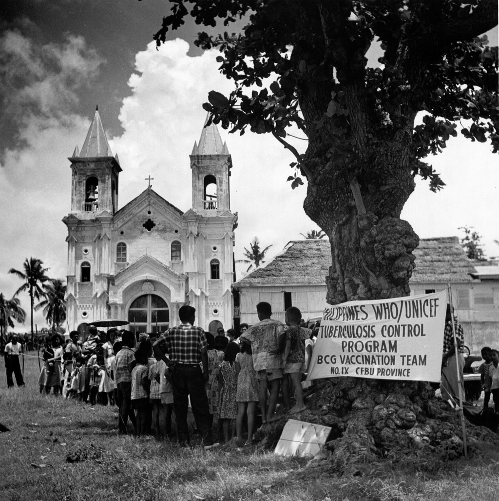 1951 People wait for their bacille Calmette-Guérin (BCG) test in Minglanilla Municipal Square, Cebu province as part of the nationwide anti-tuberculosis campaign that started in 1951.