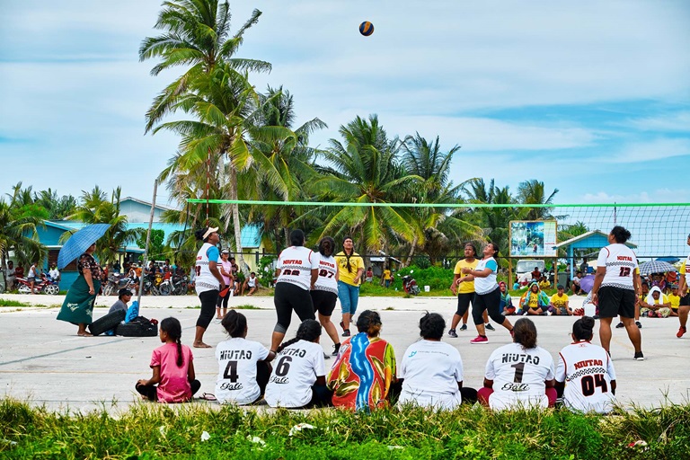 Healthier islands People playing sand volleyball